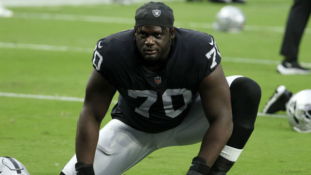 LAS VEGAS, NEVADA - SEPTEMBER 13: Offensive tackle Alex Leatherwood #70 of the Las Vegas Raiders stretches during warmups before a game against the Baltimore Ravens at Allegiant Stadium on September 13, 2021 in Las Vegas, Nevada. The Raiders defeated the Ravens 33-27 in overtime.