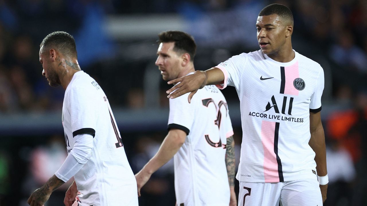 Paris Saint-Germain's French forward Kylian Mbappe gestures next to Paris Saint-Germain's Brazilian forward Neymar (L) and Paris Saint-Germain's Argentinian forward Lionel Messi (C) during the UEFA Champions League Group A football match Club Brugge against Paris Saint-Germain (PSG) at Jan Breydel Stadium in Bruges, on September 15, 2021.