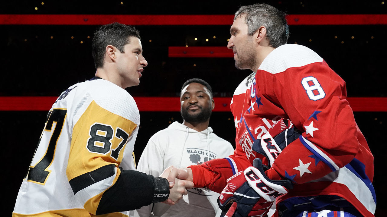 WASHINGTON, DC - FEBRUARY 23: Sidney Crosby #87 of the Pittsburgh Penguins and Alex Ovechkin #8 of the Washington Capitals shake hands after participating in a ceremonial puck drop