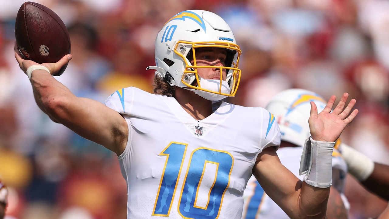 LANDOVER, MARYLAND - SEPTEMBER 12: Justin Herbert #10 of the Los Angeles Chargers makes a pass against the Washington Football Team at FedExField on September 12, 2021 in Landover, Maryland.