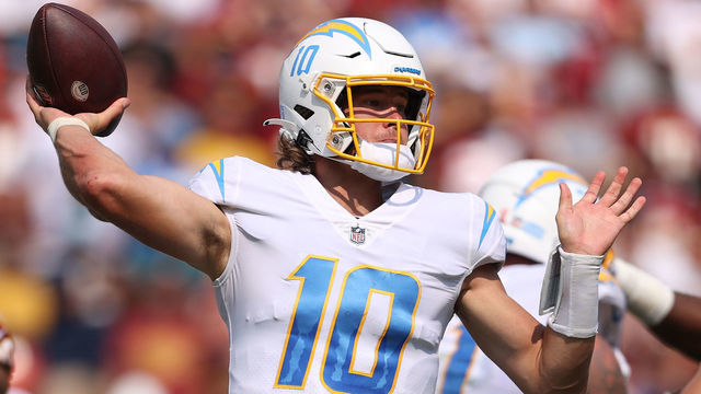 LANDOVER, MARYLAND - SEPTEMBER 12: Justin Herbert #10 of the Los Angeles Chargers makes a pass against the Washington Football Team at FedExField on September 12, 2021 in Landover, Maryland.