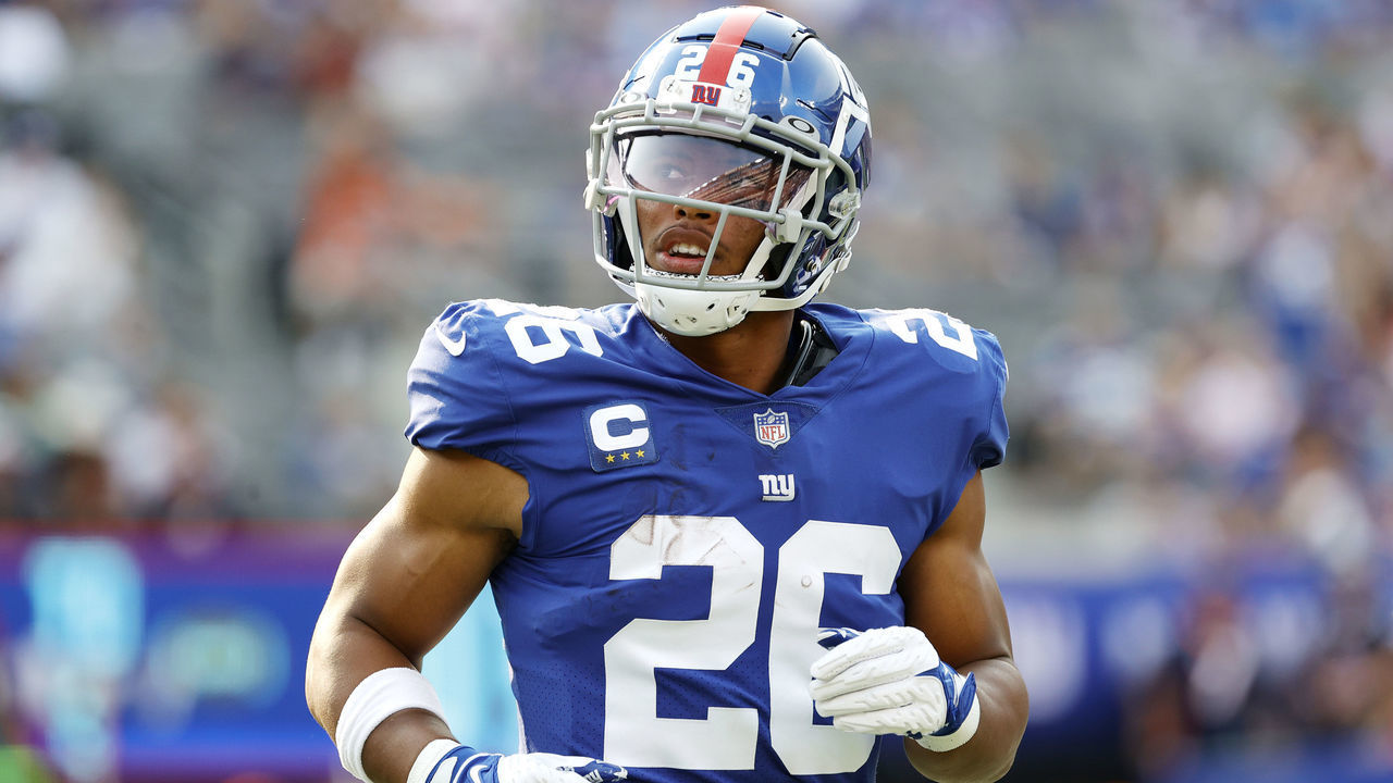 EAST RUTHERFORD, NEW JERSEY - SEPTEMBER 12: Saquon Barkley #26 of the New York Giants looks on during the game against the Denver Broncos at MetLife Stadium on September 12, 2021 in East Rutherford, New Jersey.