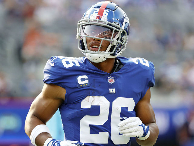 EAST RUTHERFORD, NEW JERSEY - SEPTEMBER 12: Saquon Barkley #26 of the New York Giants looks on during the game against the Denver Broncos at MetLife Stadium on September 12, 2021 in East Rutherford, New Jersey.