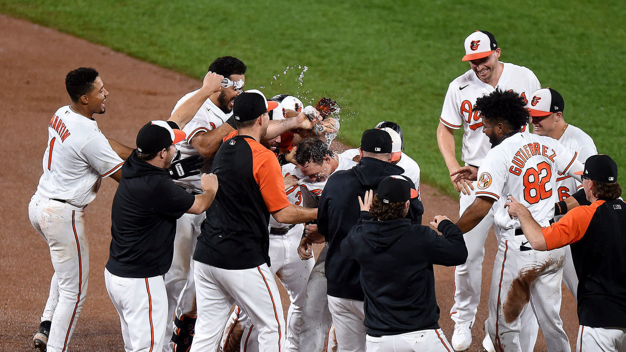 BALTIMORE, MARYLAND - SEPTEMBER 16: Austin Hays #21 of the Baltimore Orioles celebrates with teammates after driving in the game winning run in the tenth inning against the New York Yankees at Oriole Park at Camden Yards on September 16, 2021 in Baltimore, Maryland.