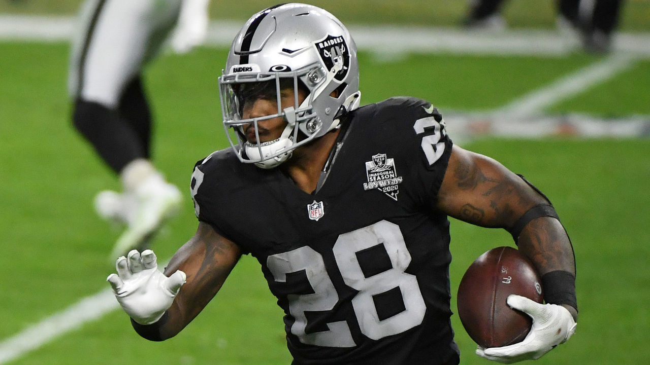 LAS VEGAS, NEVADA - DECEMBER 26: Running back Josh Jacobs #28 of the Las Vegas Raiders runs against the Miami Dolphins in the second half of their game at Allegiant Stadium on December 26, 2020 in Las Vegas, Nevada. The Dolphins defeated the Raiders 26-25.