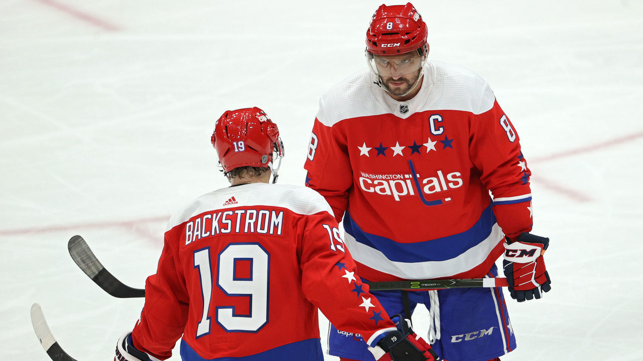 WASHINGTON, DC - FEBRUARY 10: Alex Ovechkin #8 of the Washington Capitals and Nicklas Backstrom #19 of the Washington Capitals talk to one another against the New York Islanders during the third period at Capital One Arena on February 10, 2020 in Washington, DC.