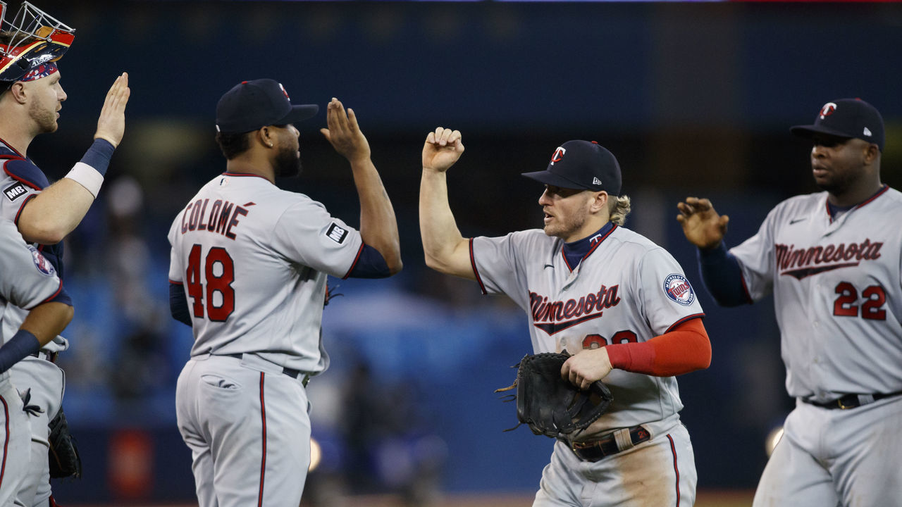 TORONTO, ON - SEPTEMBER 17: Josh Donaldson #20 and Alex Colome #48 of the Minnesota Twins celebrate their MLB game win against the Toronto Blue Jays at Rogers Centre on September 17, 2021 in Toronto, Ontario.