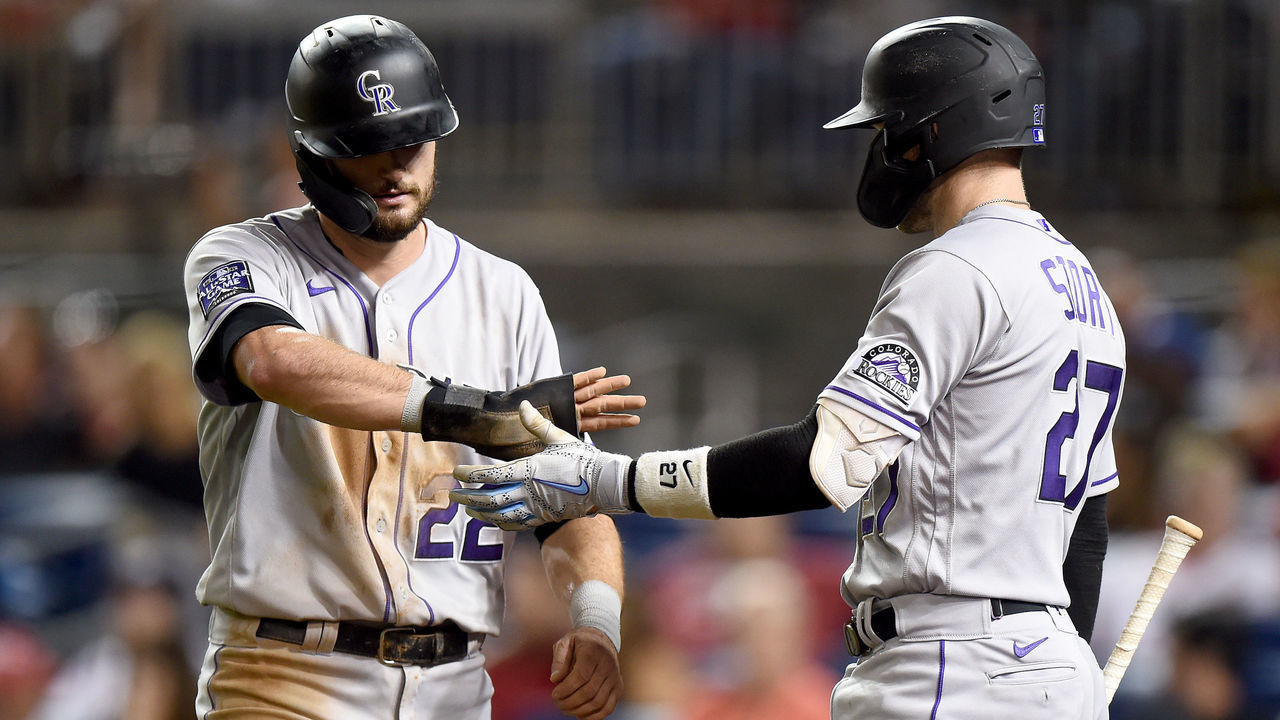 WASHINGTON, DC - SEPTEMBER 17: Sam Hilliard #22 of the Colorado Rockies celebrates with Trevor Story #27 after scoring in the ninth inning against the Washington Nationals at Nationals Park on September 17, 2021 in Washington, DC.