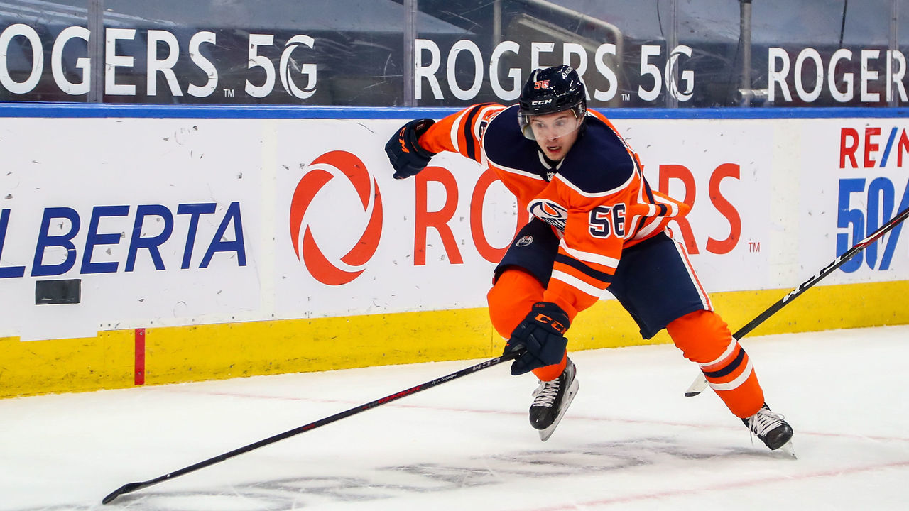 EDMONTON, AB - APRIL 02: Edmonton Oilers Right Wing Kailer Yamamoto (56) chases after a loose puck in the first period during the Edmonton Oilers game versus the Calgary Flames on APRIL 02, 2021 at Rogers Place in Edmonton, AB.