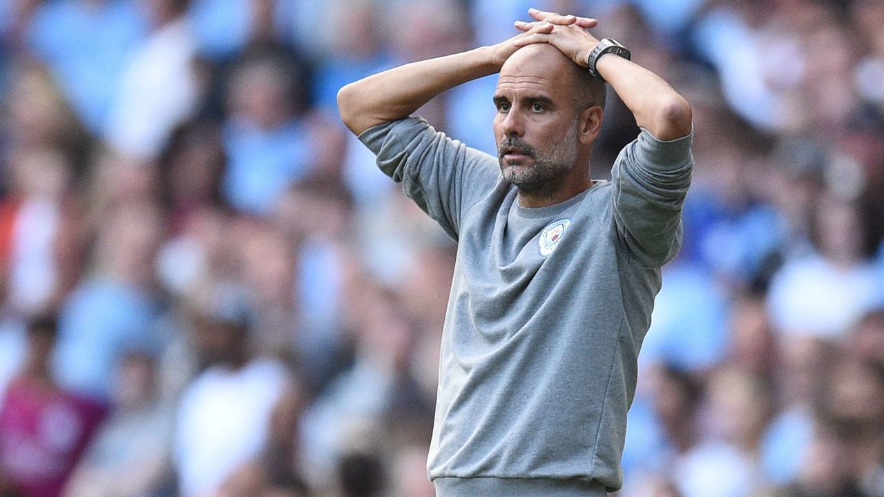 Manchester City's Spanish manager Pep Guardiola reacts during the English Premier League football match between Manchester City and Southampton at the Etihad Stadium in Manchester, north west England, on September 18, 2021. - RESTRICTED TO EDITORIAL USE. No use with unauthorized audio, video, data, fixture lists, club/league logos or 'live' services. Online in-match use limited to 120 images. An additional 40 images may be used in extra time. No video emulation. Social media in-match use limited to 120 images. An additional 40 images may be used in extra time. No use in betting publications, games or single club/league/player publications.