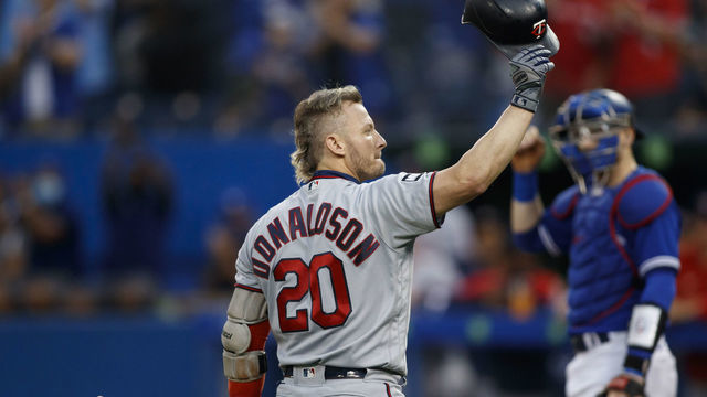 TORONTO, ON - SEPTEMBER 17: Josh Donaldson #20 of the Minnesota Twins salutes the crowd during the first inning of their MLB game against the Toronto Blue Jays at Rogers Centre on September 17, 2021 in Toronto, Ontario.