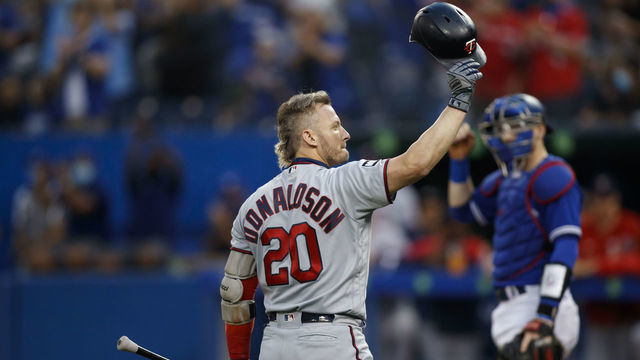 TORONTO, ON - SEPTEMBER 17: Josh Donaldson #20 of the Minnesota Twins salutes the crowd during the first inning of their MLB game against the Toronto Blue Jays at Rogers Centre on September 17, 2021 in Toronto, Ontario.