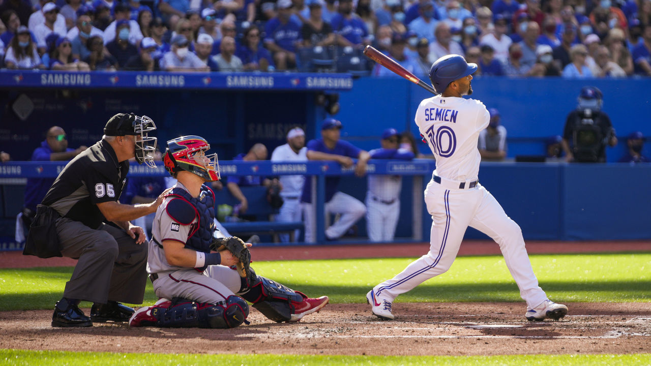TORONTO, ONTARIO - SEPTEMBER 18: Marcus Semien #10 of the Toronto Blue Jays hits a home run against the Minnesota Twins in the fourth inning during their MLB game at the Rogers Centre on September 18, 2021 in Toronto, Ontario, Canada.