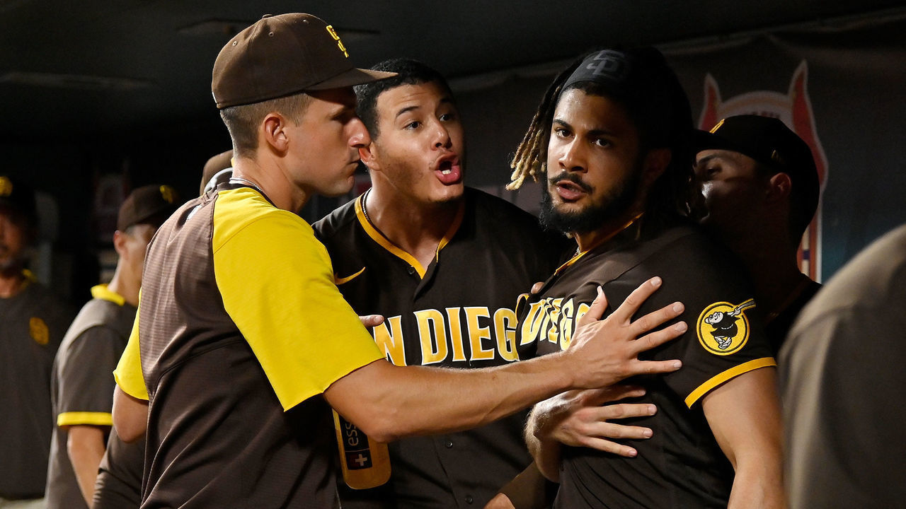 ST LOUIS, MO - SEPTEMBER 18: Manny Machado #13 and Fernando Tatis Jr. #23 of the San Diego Padres exchange words in the dugout during the fifth inning against the St. Louis Cardinals at Busch Stadium on September 18, 2021 in St Louis, Missouri.