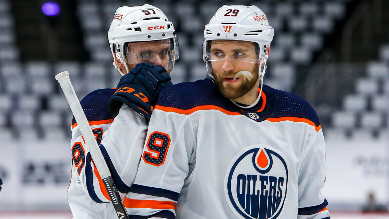 WINNIPEG, MB - MAY 24: Connor McDavid #97 and Leon Draisaitl #29 of the Edmonton Oilers discuss strategy during a first period stoppage of play against the Winnipeg Jets in Game Four of the First Round of the 2021 Stanley Cup Playoffs at Bell MTS Place on May 24, 2021 in Winnipeg, Manitoba.