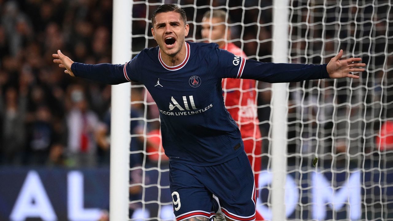 Paris Saint-Germain's Argentinian forward Mauro Icardi celebrates scoring his team's second goal during the French L1 football match between Paris-Saint Germain (PSG) and Olympique Lyonnais at The Parc des Princes Stadium in Paris on September 19, 2021.