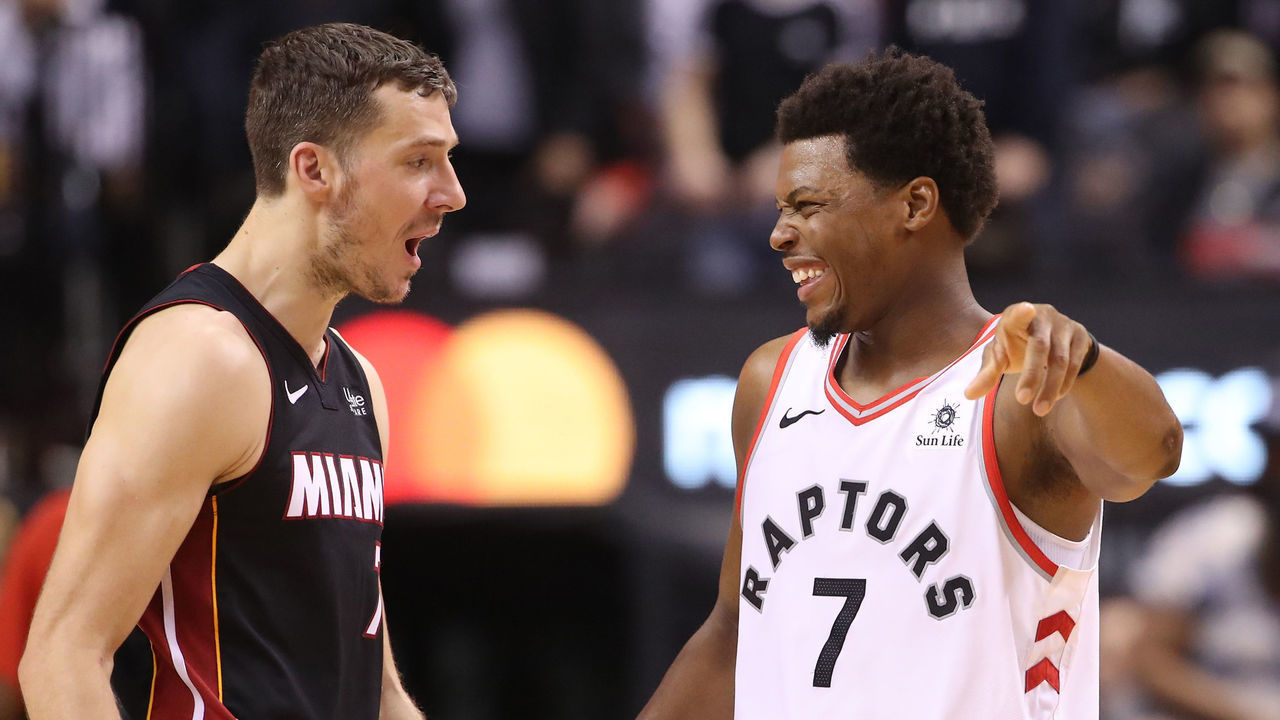 TORONTO, ON - APRIL 07: Kyle Lowry #7 (R) of the Toronto Raptors shares a laugh with Goran Dragic #7 (L) of the Miami Heat at Scotiabank Arena on April 7, 2019 in Toronto, Canada.
