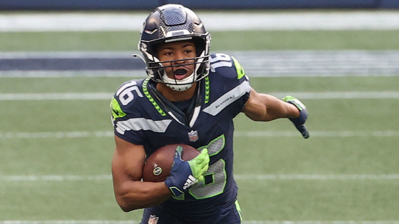 SEATTLE, WASHINGTON - DECEMBER 06: Tyler Lockett #16 of the Seattle Seahawks runs with the ball in the third quarter against the New York Giants at Lumen Field on December 06, 2020 in Seattle, Washington.