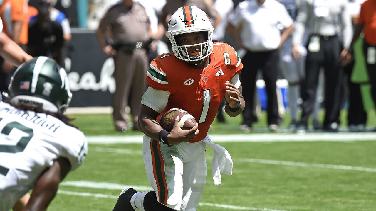 MIAMI GARDENS, FL - SEPTEMBER 18: Miami quarterback D'Eriq King (1) carries the ball in the second quarter as the University of Miami Hurricanes faced the Michigan State University Spartans on September 18, 2021, at Hard Rock Stadium in Miami Gardens, Florida.
