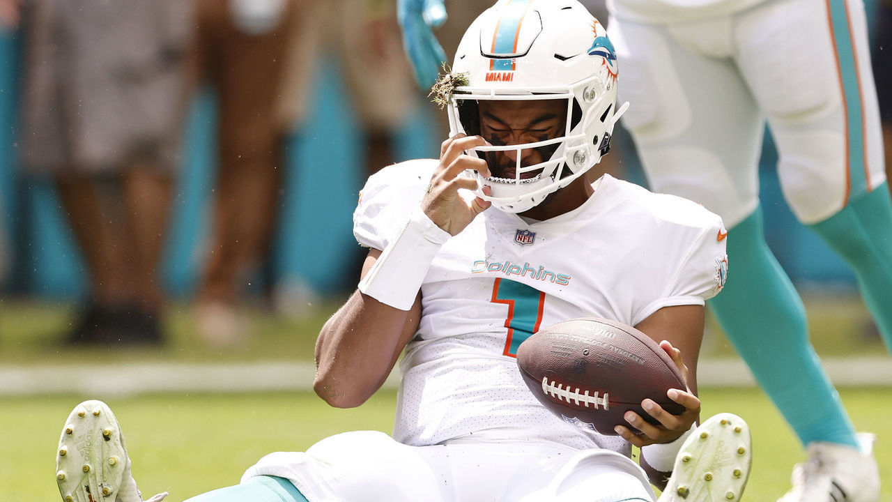 MIAMI GARDENS, FLORIDA - SEPTEMBER 19: Tua Tagovailoa #1 of the Miami Dolphins reacts after being sacked against the Buffalo Bills during the first quarter at Hard Rock Stadium on September 19, 2021 in Miami Gardens, Florida.