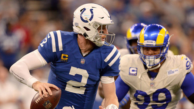 INDIANAPOLIS, IN - SEPTEMBER 19: Los Angeles Rams Defensive Tackle Aaron Donald (99) pursues Indianapolis Colts Quarterback Carson Wentz (2) during the NFL football game between the Los Angeles Rams and the Indianapolis Colts on September 19, 2021, at Lucas Oil Stadium in Indianapolis, Indiana.