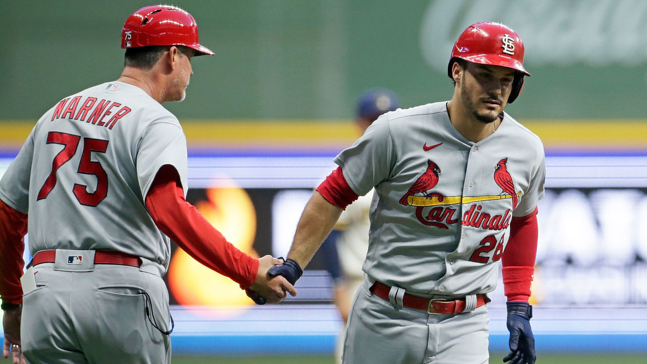 MILWAUKEE, WISCONSIN - SEPTEMBER 20: Nolan Arenado #28 of the St. Louis Cardinals is congratulated by Ron 'Pop' Warner #75 after hitting a two run homer in the first inning against the Milwaukee Brewers at American Family Field on September 20, 2021 in Milwaukee, Wisconsin.