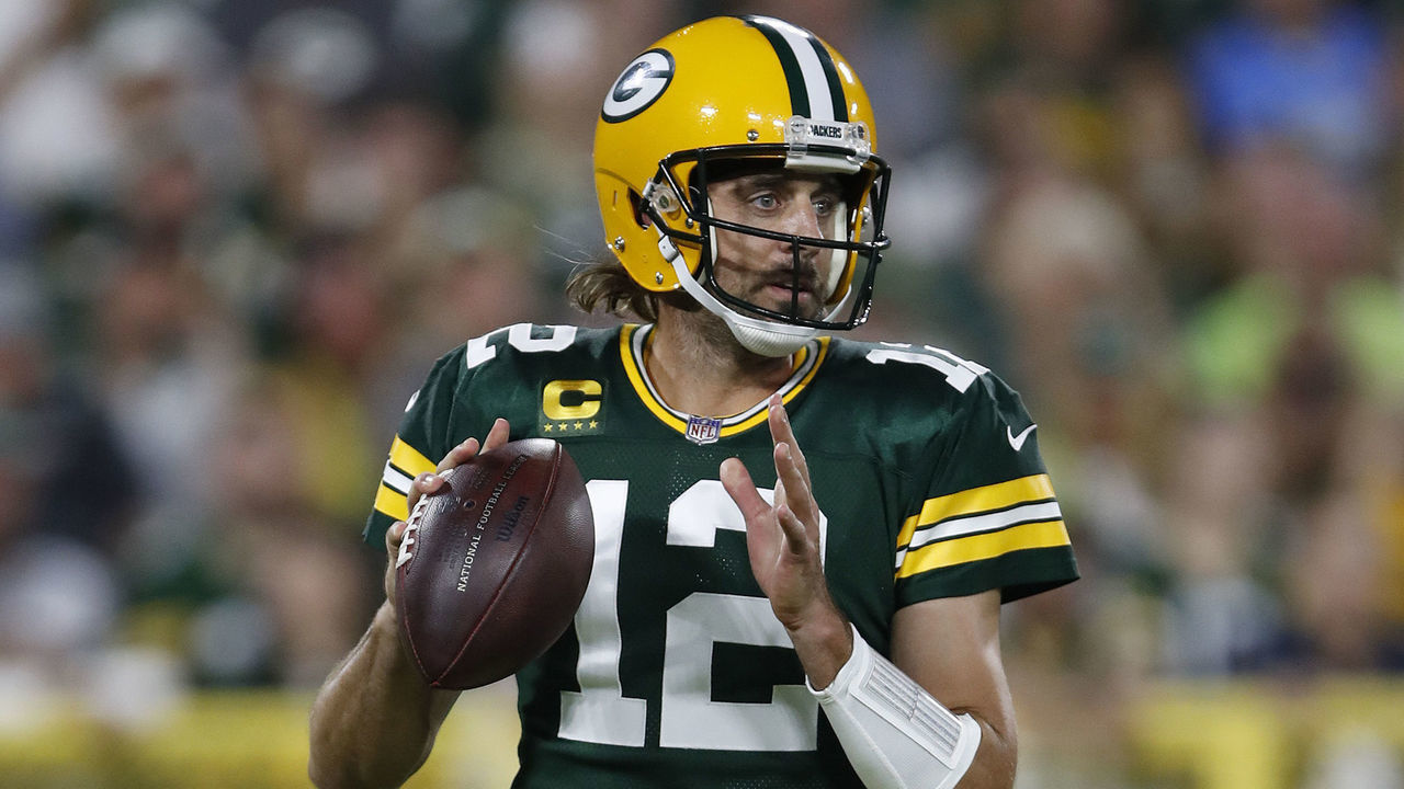 GREEN BAY, WISCONSIN - SEPTEMBER 20: Aaron Rodgers #12 of the Green Bay Packers passes against the Detroit Lions during the first half at Lambeau Field on September 20, 2021 in Green Bay, Wisconsin.