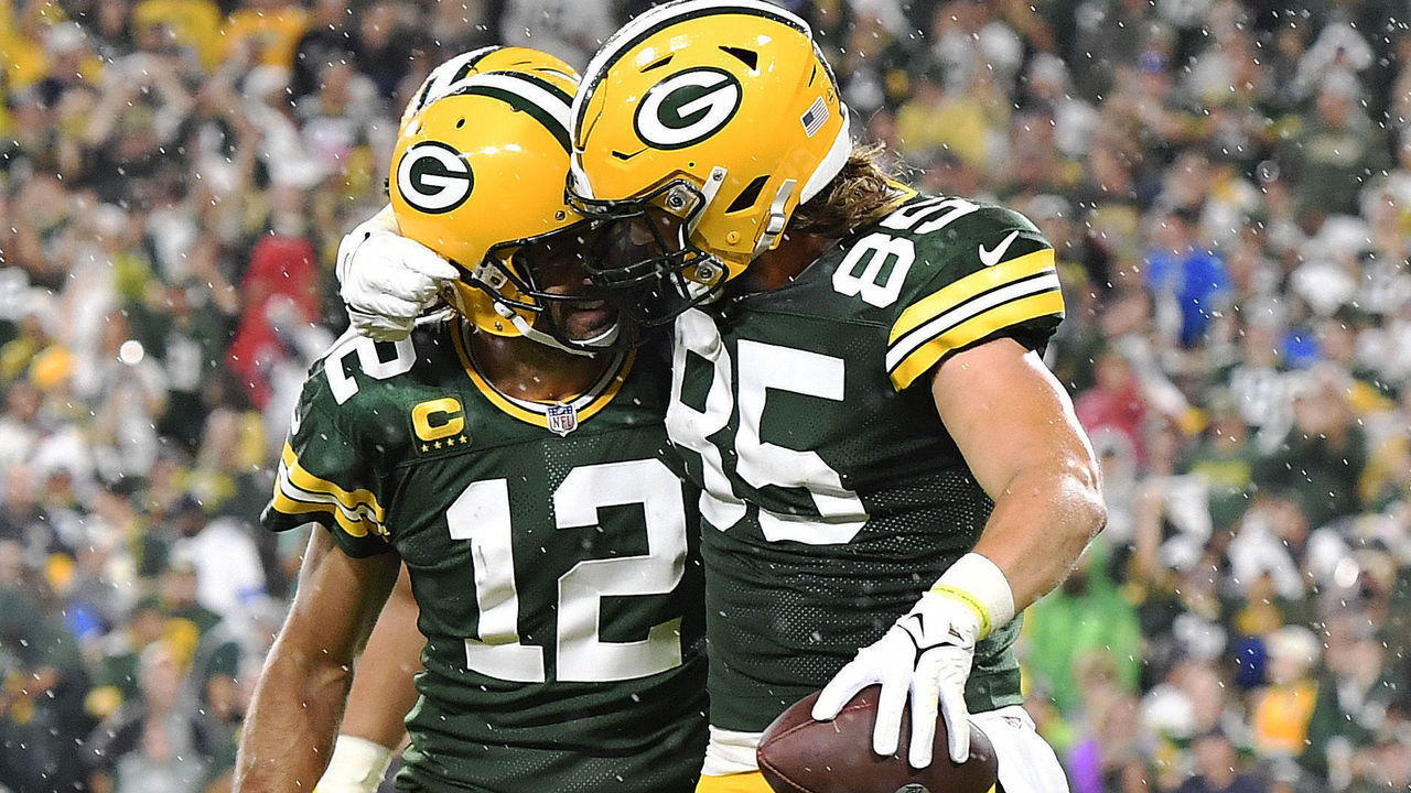 GREEN BAY, WISCONSIN - SEPTEMBER 20: Robert Tonyan #85 of the Green Bay Packers and Aaron Rodgers #12 celebrate a touchdown against the Detroit Lions during the second half at Lambeau Field on September 20, 2021 in Green Bay, Wisconsin.