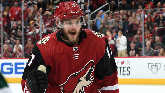 GLENDALE, AZ - MARCH 31: Alex Galchenyuk #17 of the Arizona Coyotes celebrates as he skates back to the bench after scoring a goal against the Minnesota Wild during the first period at Gila River Arena on March 31, 2019 in Glendale, Arizona.