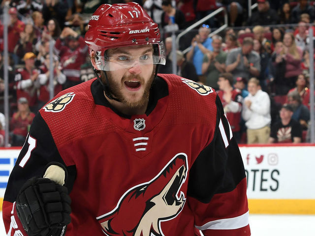 GLENDALE, AZ - MARCH 31: Alex Galchenyuk #17 of the Arizona Coyotes celebrates as he skates back to the bench after scoring a goal against the Minnesota Wild during the first period at Gila River Arena on March 31, 2019 in Glendale, Arizona.