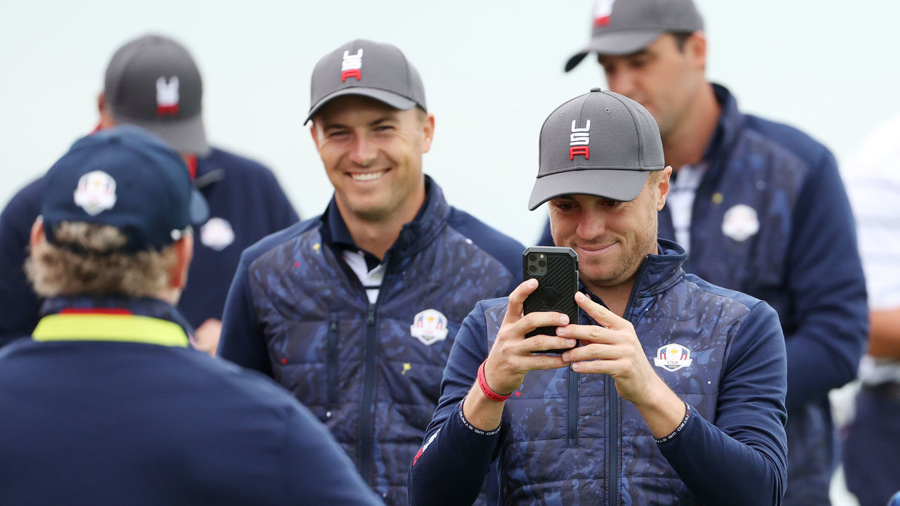 KOHLER, WISCONSIN - SEPTEMBER 21: Jordan Spieth of team United States (L) and Justin Thomas of team United States take photos on the third green prior to the 43rd Ryder Cup at Whistling Straits on September 21, 2021 in Kohler, Wisconsin.