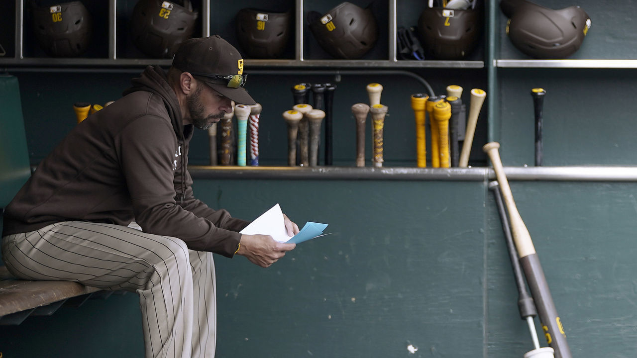 SAN FRANCISCO, CALIFORNIA - SEPTEMBER 16: Manager Jayce Tingler #32 of the San Diego Padres looks over his lineup card while sitting in the dugout prior to the start of the game against the San Francisco Giants at Oracle Park on September 16, 2021 in San Francisco, California.