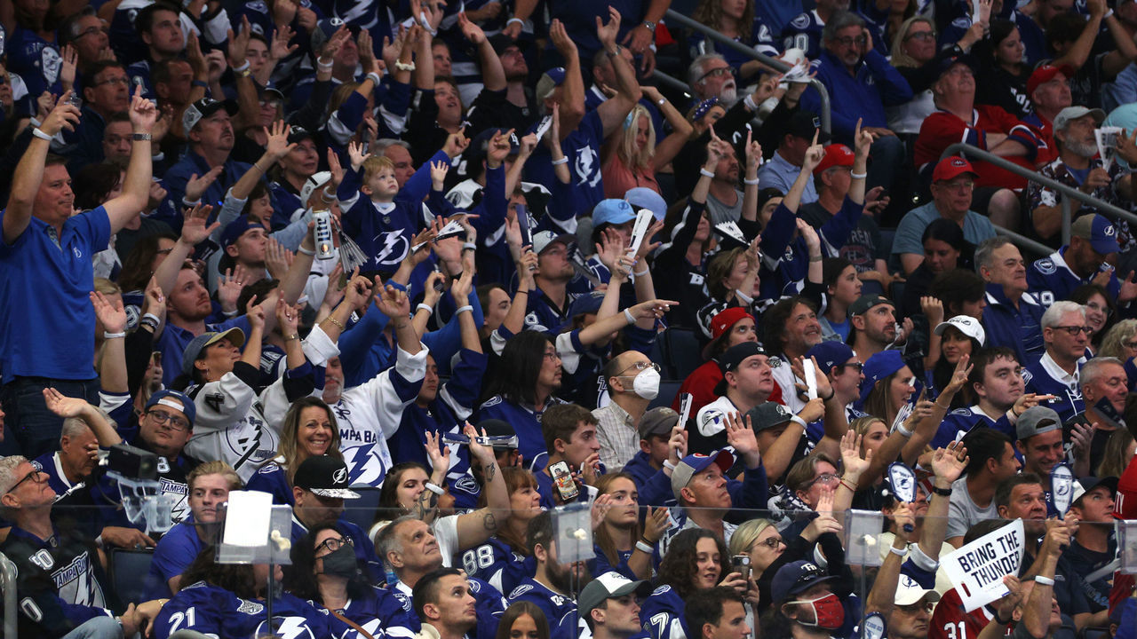 TAMPA, FLORIDA - JULY 07: Fans celebrate the Tampa Bay Lightning's 1-0 victory in Game Five of the 2021 Stanley Cup Final to take the series four games to one against the Montreal Canadiens at Amalie Arena on July 07, 2021 in Tampa, Florida.