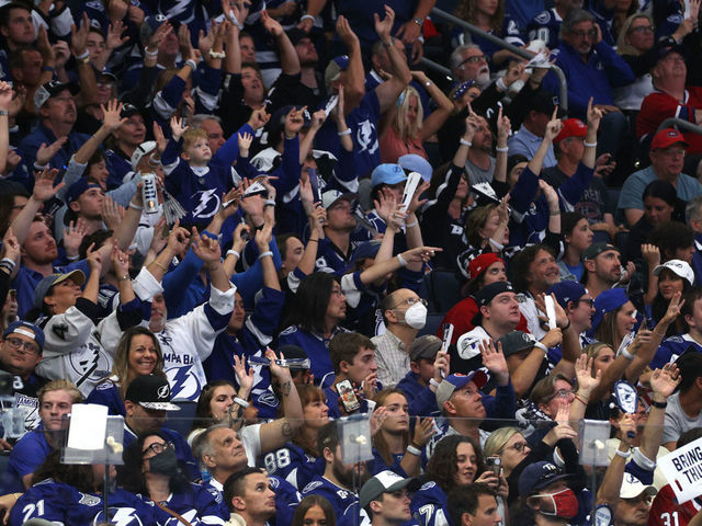 TAMPA, FLORIDA - JULY 07: Fans celebrate the Tampa Bay Lightning's 1-0 victory in Game Five of the 2021 Stanley Cup Final to take the series four games to one against the Montreal Canadiens at Amalie Arena on July 07, 2021 in Tampa, Florida.