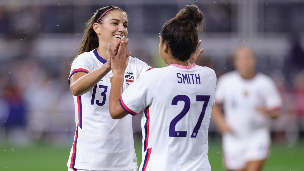 CINCINNATI, OH - SEPTEMBER 21: United States forward Alex Morgan (13) celebrates with forward Sophia Smith (27) and teammates after scoring a goal during a friendly match between United States and Paraguay on September 21, 2021 at TQL Stadium in Cincinnati, OH.