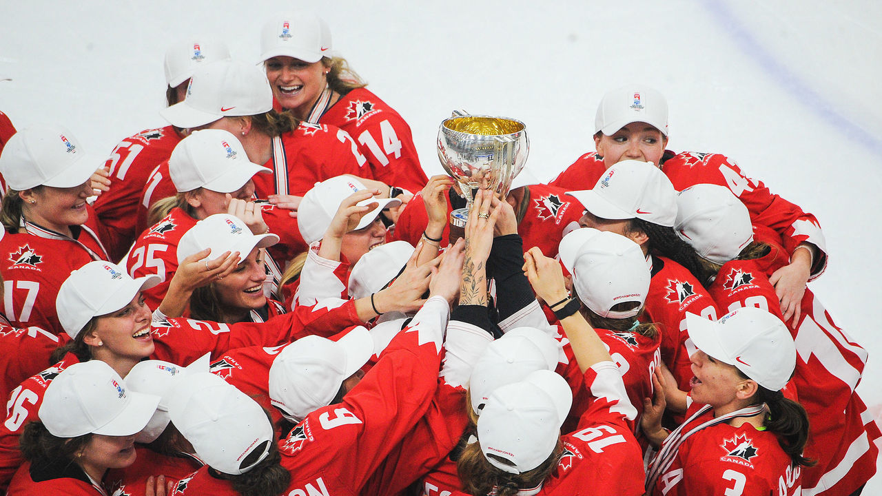 CALGARY, AB - AUGUST 31: Team Canada hoists the championship trophy after their victory over United Sates in the 2021 IIHF Women's World Championship gold medal game played at WinSport Arena on August 31, 2021 in Calgary, Canada.