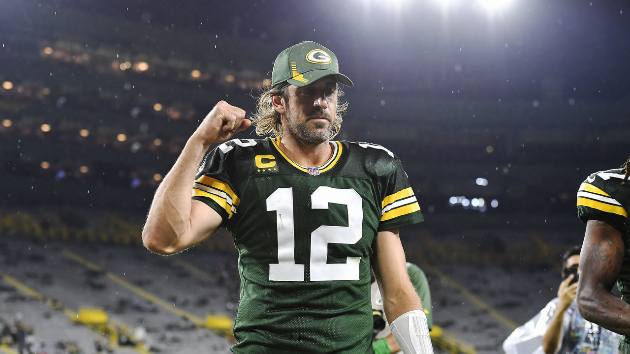 GREEN BAY, WISCONSIN - SEPTEMBER 20: Aaron Rodgers #12 of the Green Bay Packers reacts as he walks of the field following the team's win against the Detroit Lions during an NFL football game at Lambeau Field on September 20, 2021 in Green Bay, Wisconsin.