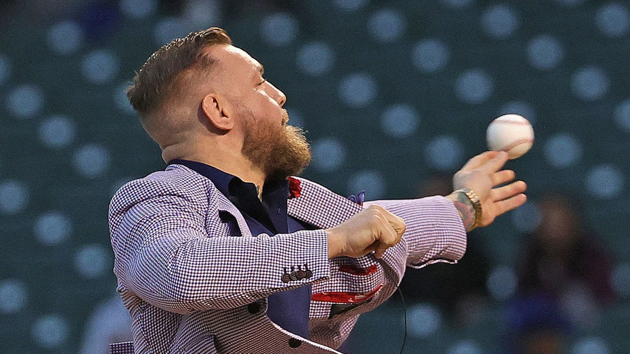 CHICAGO, ILLINOIS - SEPTEMBER 21: Conor McGregor throws out a ceremonial first pitch before the Chicago Cubs take on the Minnesota Twins at Wrigley Field on September 21, 2021 in Chicago, Illinois.
