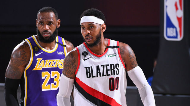 ORLANDO, FL - AUGUST 22: LeBron James #23 of the Los Angeles Lakers and Carmelo Anthony #00 of the Portland Trail Blazers looks on during Round One, Game Three of the NBA Playoffs on August 22, 2020 at AdventHealth Arena in Orlando, Florida. NOTE TO USER: User expressly acknowledges and agrees that, by downloading and/or using this Photograph, user is consenting to the terms and conditions of the Getty Images License Agreement. Mandatory Copyright Notice: Copyright 2020 NBAE