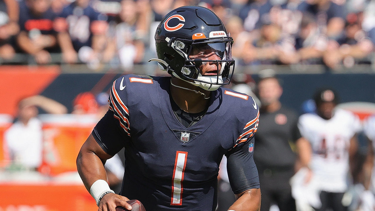 CHICAGO, ILLINOIS - SEPTEMBER 19: Justin Fields #1 of the Chicago Bears rolls out to look for a receiver against the Cincinnati Bengals at Soldier Field on September 19, 2021 in Chicago, Illinois. The Bears defeated the Bengals 20-17.
