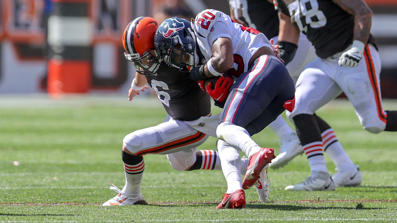 CLEVELAND, OH - SEPTEMBER 19: Cleveland Browns quarterback Baker Mayfield (6) makes the tackle on Houston Texans safety Justin Reid (20) after Reid intercepted a Mayfield pass during the second quarter of the the National Football League game between the Houston Texans and Cleveland Browns on September 19, 2021, at FirstEnergy Stadium in Cleveland, OH. Mayfield was shaken up on the play but stayed in the game.