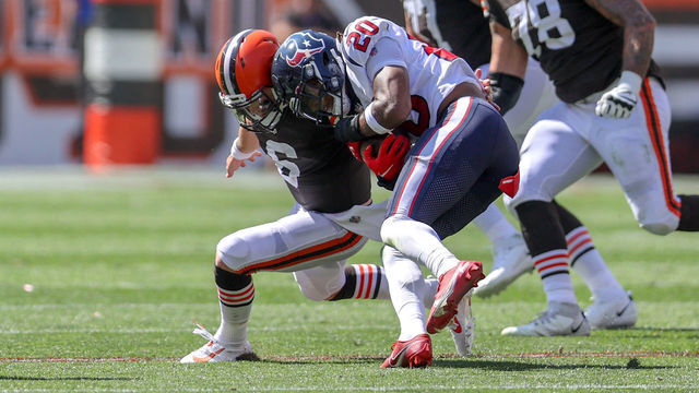 CLEVELAND, OH - SEPTEMBER 19: Cleveland Browns quarterback Baker Mayfield (6) makes the tackle on Houston Texans safety Justin Reid (20) after Reid intercepted a Mayfield pass during the second quarter of the the National Football League game between the Houston Texans and Cleveland Browns on September 19, 2021, at FirstEnergy Stadium in Cleveland, OH. Mayfield was shaken up on the play but stayed in the game.