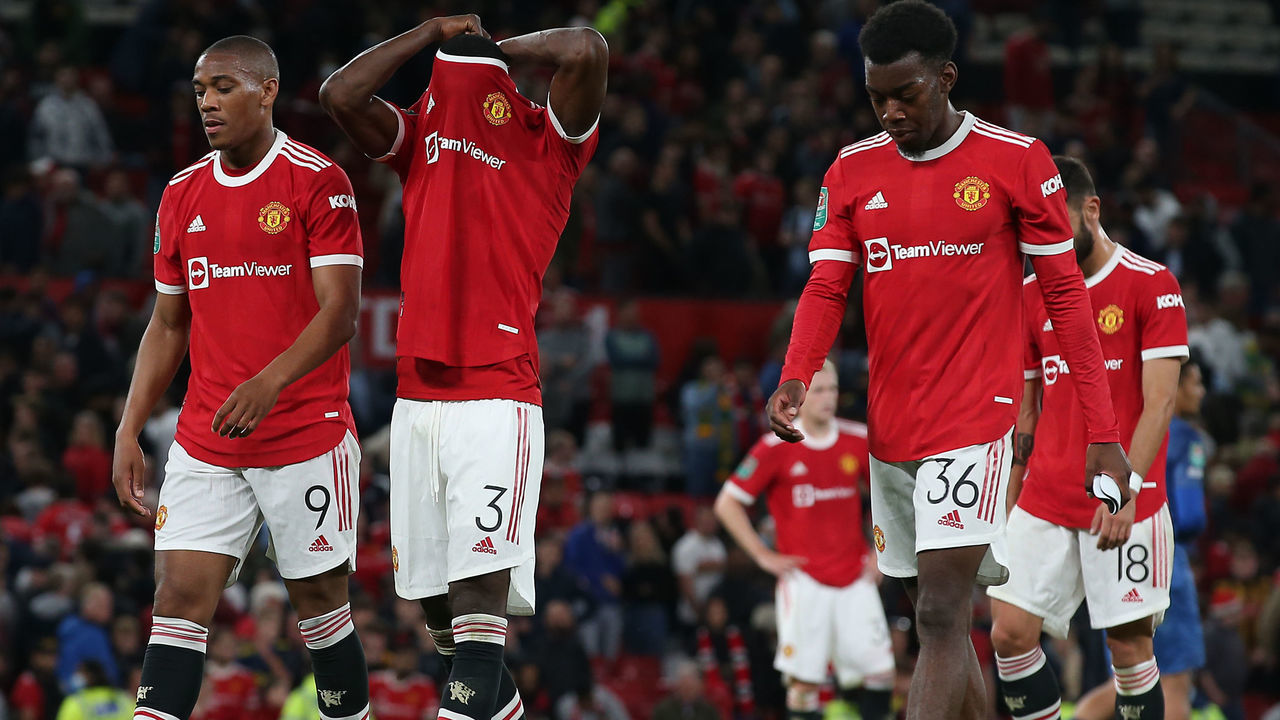 MANCHESTER, ENGLAND - SEPTEMBER 22: Anthony Martial and Eric Bailly and Anthony Elanga of Manchester United show their disappointment after the Carabao Cup Third Round match between Manchester United and West Ham United at Old Trafford on September 22, 2021 in Manchester, England.