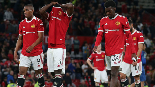 MANCHESTER, ENGLAND - SEPTEMBER 22: Anthony Martial and Eric Bailly and Anthony Elanga of Manchester United show their disappointment after the Carabao Cup Third Round match between Manchester United and West Ham United at Old Trafford on September 22, 2021 in Manchester, England.