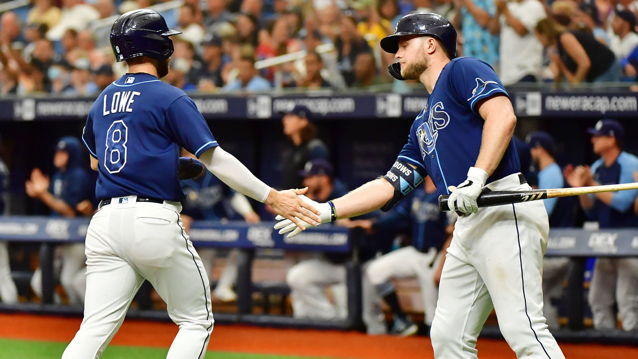 ST PETERSBURG, FLORIDA - SEPTEMBER 22: Austin Meadows #17 celebrates with Brandon Lowe #8 of the Tampa Bay Rays after a run in the third inning against the Toronto Blue Jays at Tropicana Field on September 22, 2021 in St Petersburg, Florida.