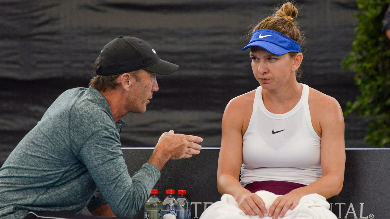 Simona Halep of Romania talks to her coach Darren Cahill during her women's singles quarter-final match against Aryna Sabalenka of Belarus at the Adelaide International tennis tournament in Adelaide on January 16, 2020.