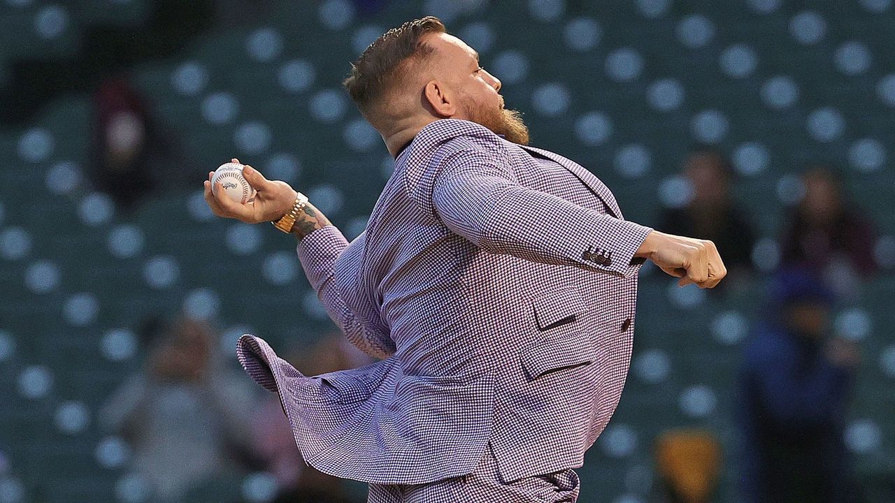 CHICAGO, ILLINOIS - SEPTEMBER 21: Conor McGregor throws out a ceremonial first pitch before the Chicago Cubs take on the Minnesota Twins at Wrigley Field on September 21, 2021 in Chicago, Illinois.
