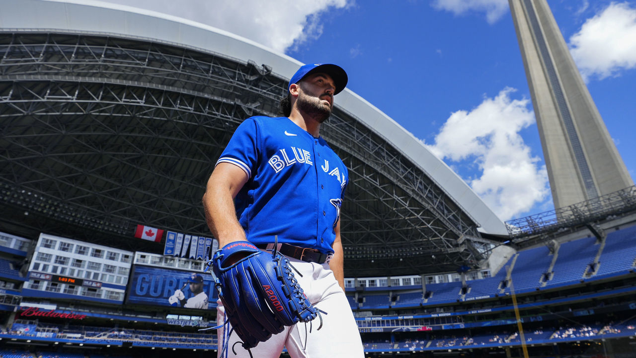 TORONTO, ONTARIO - SEPTEMBER 5: Robbie Ray #38 of the Toronto Blue Jays walks from the bullpen to the dugout under the CN Tower ahead of the start against the Oakland Athletics in their MLB game at the Rogers Centre on September 5, 2021 in Toronto, Ontario, Canada.