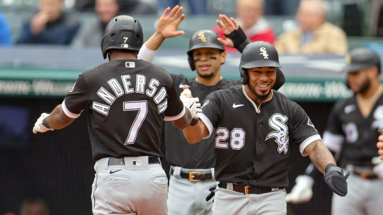 CLEVELAND, OH - SEPTEMBER 23: Chicago White Sox shortstop Tim Anderson (7) is congratulated by Chicago White Sox right fielder Leury Garcia (28) and Chicago White Sox second baseman Cesar Hernandez (12) after crossing home plate after hitting a 3-run home run for his second home run of the game during the second inning of game one of the the Major League Baseball doubleheader between the Chicago White Sox and Cleveland Indians on September 23, 2021, at Progressive Field in Cleveland, OH.