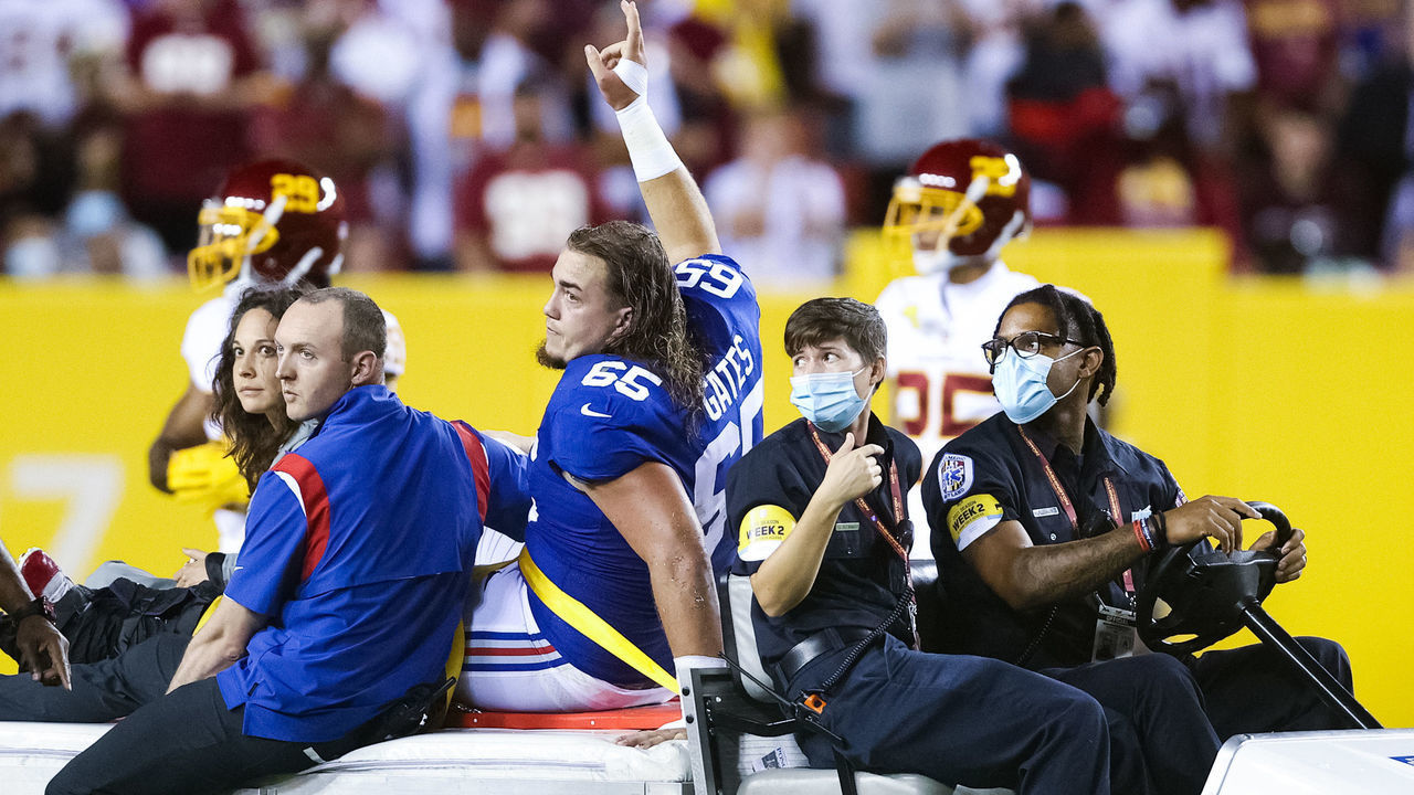 LANDOVER, MARYLAND - SEPTEMBER 16: Nick Gates #65 of the New York Giants exits the game following an injury during the first quarter against the Washington Football Team at FedExField on September 16, 2021 in Landover, Maryland.